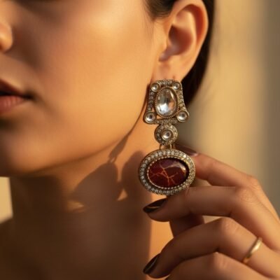 01 womlysh gold toned metal and marbled resin statement drop earrings maroon and gold earrings model view 799