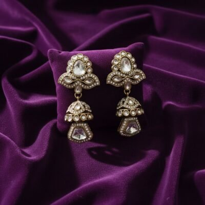 04 womlysh gold toned metal and gleaming crystals jhumka antique gold earrings top down view 649