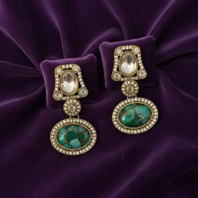 04 womlysh gold toned metal emerald hued stones gleaming crystals drop earrings green and gold earrings top down view 749