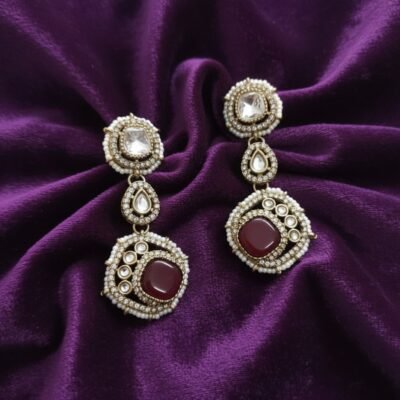 04 womlysh gold toned metal faux pearls gleaming crystals tiered drop earrings maroon gold white earrings top down view 649